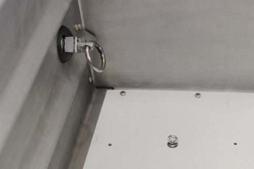 The rear baggage wall is very strong here,  Many attach screws in the area.