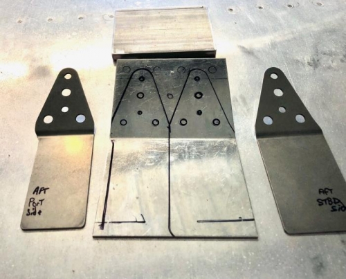 Bottom of steel reinforcements get match drilled to existing spar bolt holes.