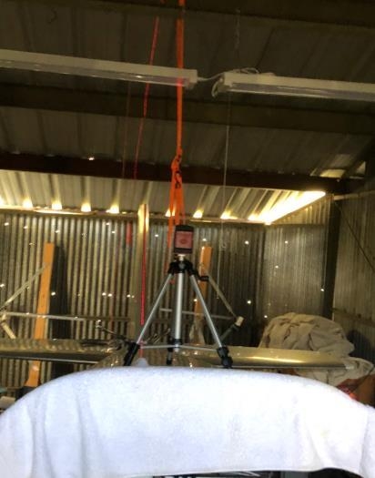 The leveler is sitting on the rear canopy glass.  Not the best picture of the stabilizer.