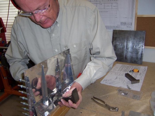 Bucking the flush rivets to the main spar.