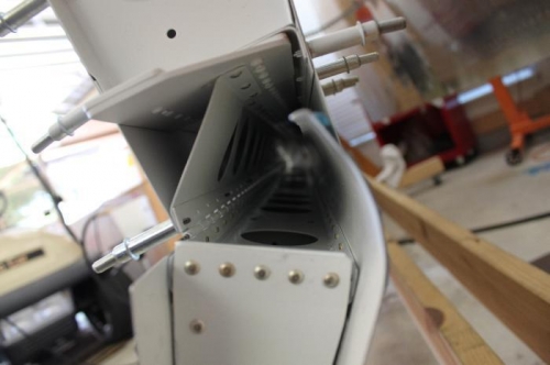 Getting ready to remove flap and rivet the other half of the flap hinge to the wing.