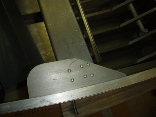 Co pilot side.  Curved section is supposed to face forward.