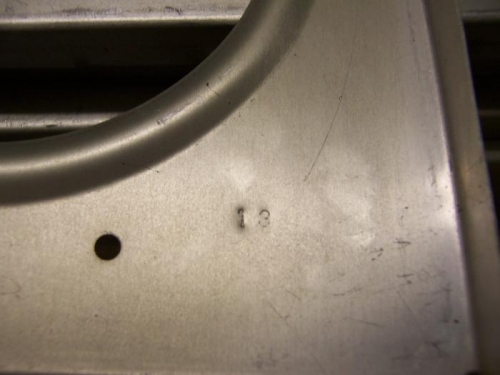 Stamped numbers into ribs.