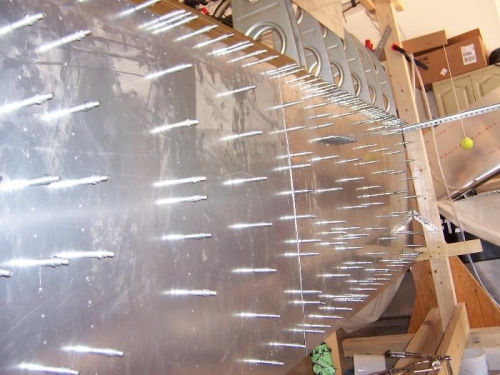 Had to borrow clecoes from the bottom skins.  Any more progress and  it will  be 4 clecoes per skin