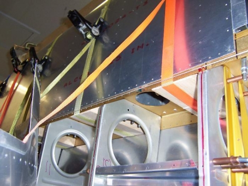 2x4 blocks keep the main spar flange stiff while tightening the straps.