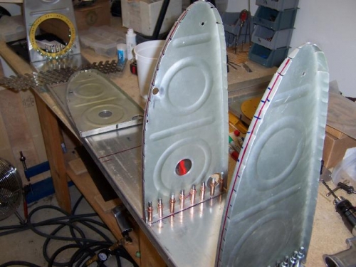 Drill and clecoe the tank ribs to the rear baffle.