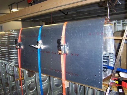 Pulling the skins into positon for drilling the ribs.