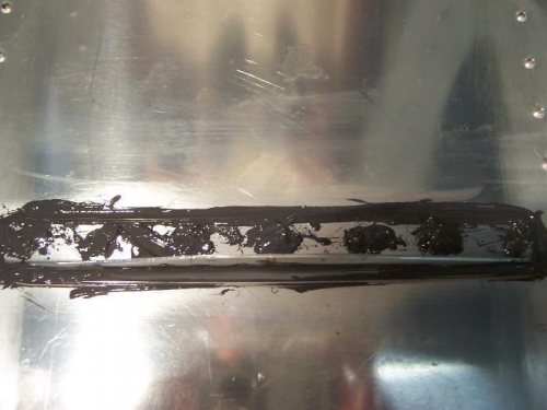 After dressing up and encapsulating the rivet heads