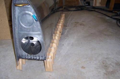 Letting gravity help seal the baffle/skin joint.