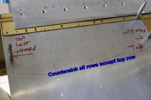 Wing walk doubler fits under main spar flange and on top of ribs