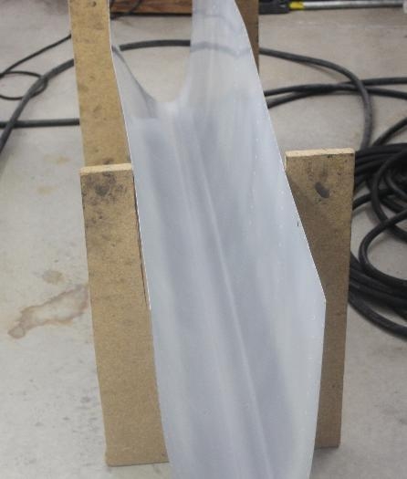 The leading edge painted and back in the jig.