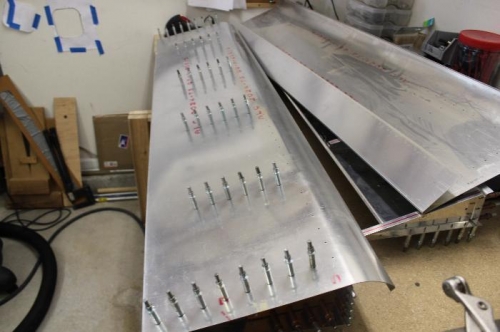 You slip the top skin over the bottom and drill it into place.