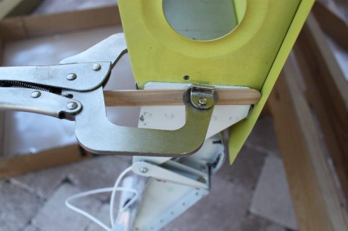 Positioned and clamped outboard aileron bracket