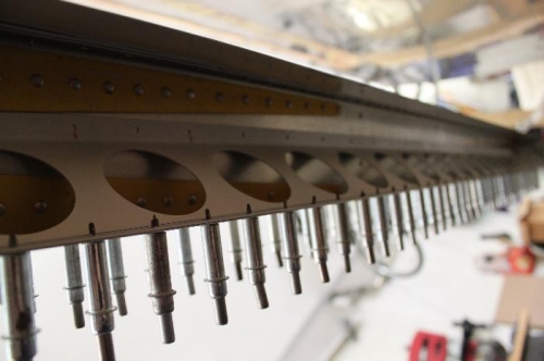 Flap brace match drilled to wing skin.