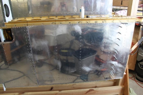 Rivetied outboard to the outboard skin overlap and stopped.  Then went back to wing walk ribs.