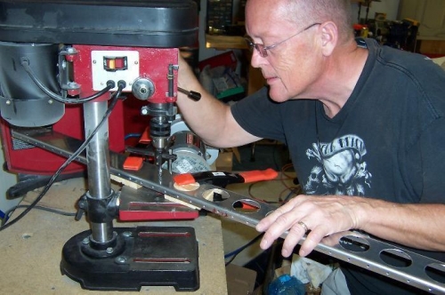 Making the lightening holes on the drill press.