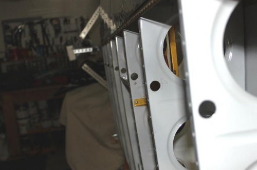 Enlarged each 1/2 in hole to 3/4 and pushed them away from rib flange.