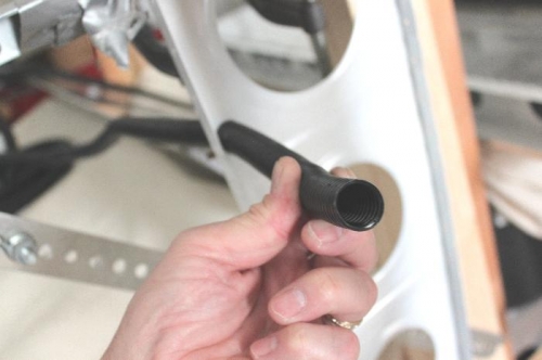 You have to pull on this stuff to stretch and shrink the diameter momentarily.  Returns to normal.