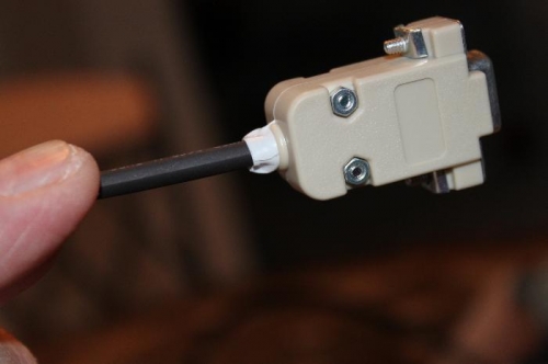 White electrical tape fills up the space in the rear exit hole. Black shrinkwrap for strength.