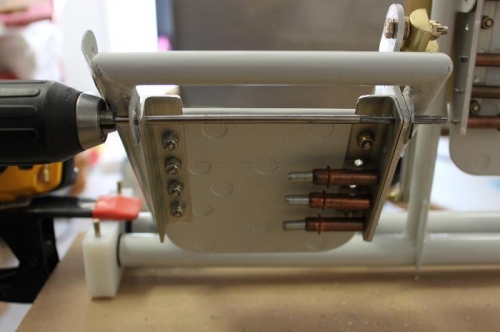 Ream both sides to result in one plane for the pedal to pivot on. .189 Reamer.