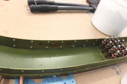 I set the roll bar ontop of 1/8 inch spacers to make room for the squeeze riveter to work.