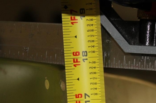 Har to hold the tape and take a picture but it is exactly 17 7/8 high.