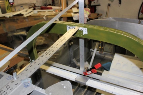 Long angle secures the upright piece of angle. Yardstick clamps the roll bar at desired tilt.