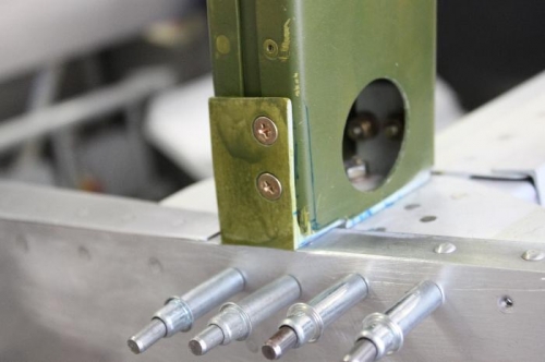 No more overhang of the 3/16 angle.  Filed flush and contoured to fuselage shape.