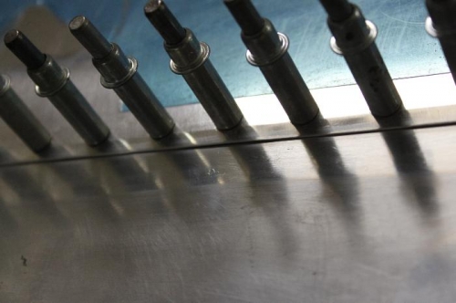 Cut off excess on bottom of the aft skins. Rolled the overlap and it came out really nice.  Good tool.