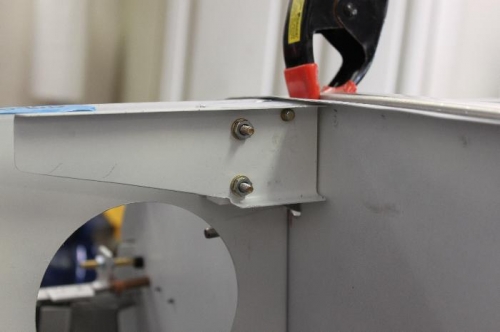 Each side looks the same.  Last hole drilled is the hinge bolt hole.