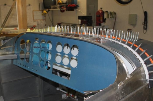 Only 5 or 6 fuselage longeron holes to match drill  before trimming thie forward skin