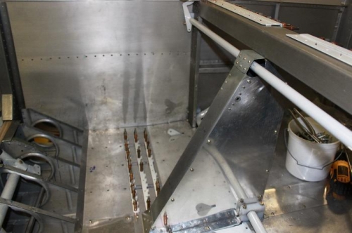 Note on side cover the extra holes drilled to clear shop heads and the flap motor mounting bolt hole