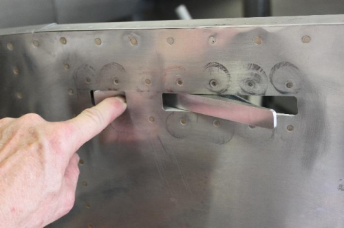 Push the forward button and the locking lever can be opened outward to unlock canopy.