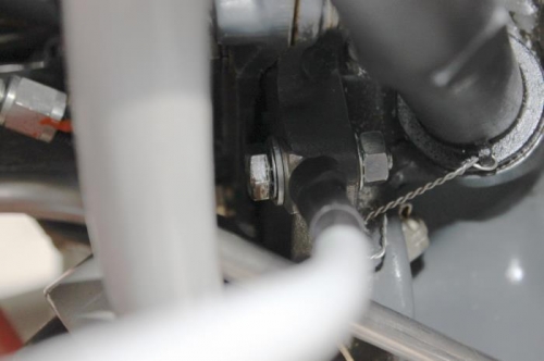 Used empty hole near the oil fill tube. Reamed it to 5/16 and bolted it up.