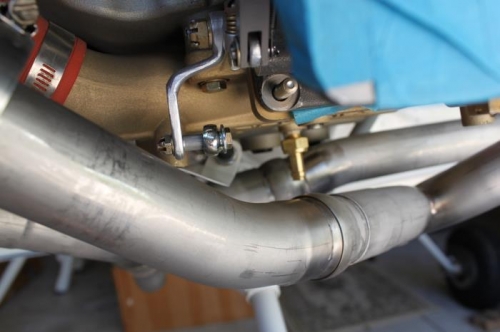 Straight sniffle mounted in rear most sump opening. Room to run under exh pipe to firewall.