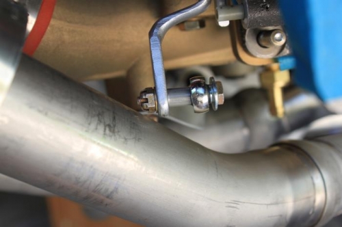 Clearance between throttle arm nut and #1 pipe. Close but ok.