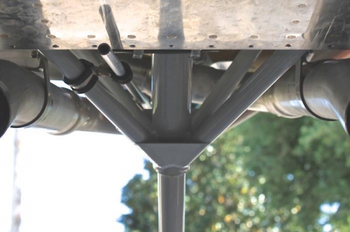 Exit area secured with adel clamps to engine mount.