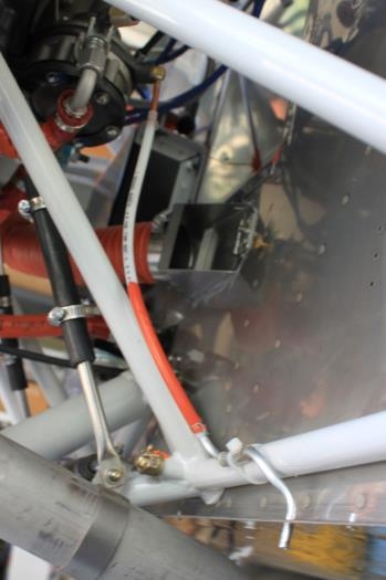 Line shown from pump to exit out bottom of firewall flange.