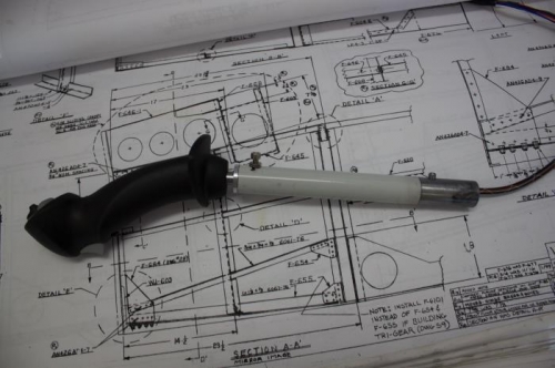 I tried raising the stick slightly in the bushing.  At this height the set screw nests in a recess.