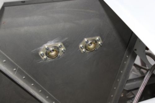 Cables will get inside adel clamp support just before heading out the grommets.