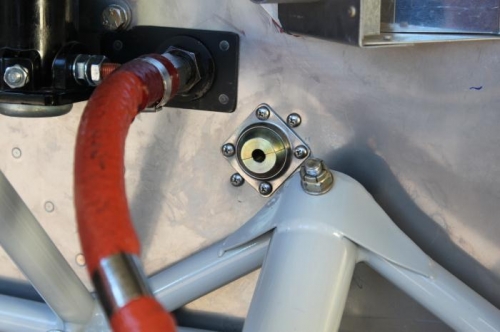 Spherical steel grommet will hold the throttle cable. Also note steel fuel fitting.