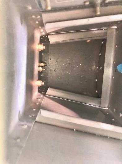 Looking down into aft bulkhead space to confirm all 4 lower attach bolts were successfully attached.
