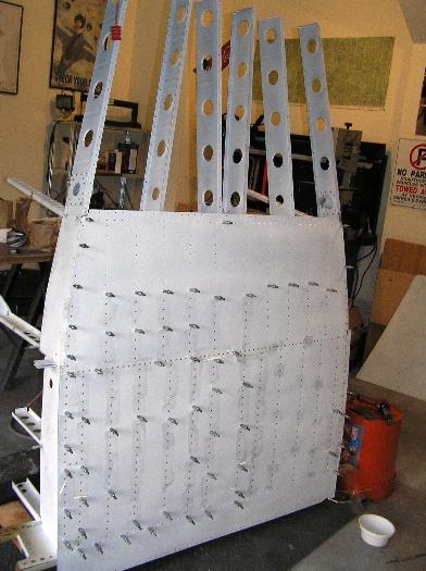 Working on riveting the Bottom Skins F-1076 to the F-1034A Fuselage Bulkhead,