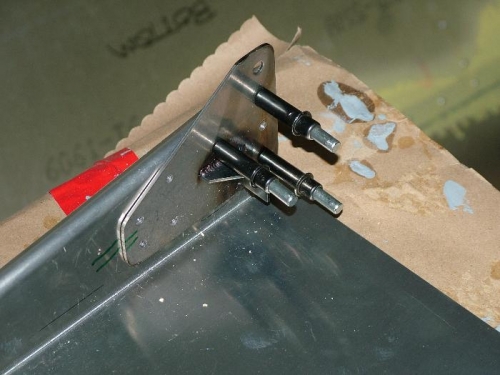 Seat back bracket on seat pan