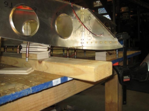 Shims under wing (note clamp at right, holding down spar)