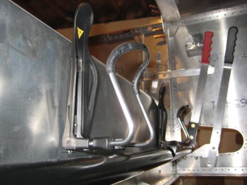 Water bottles reinstalled above flap tube