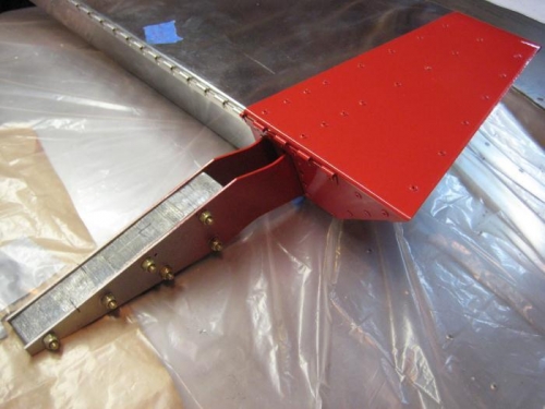 Left aileron: masking tape removed, paint buffed, & lead counterweight added