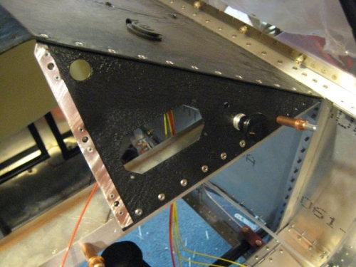 Right side of panel riveted in place.