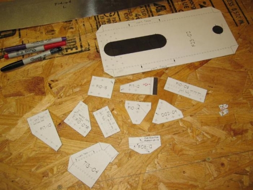 Hard to see, but patterns pasted on metal, then cut w/ shears