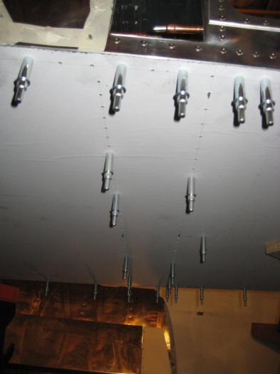 Pilot drilled into the lower flanges of the spar tunnel webs